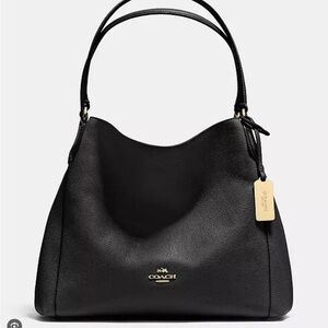 COACH Edie 31 Shoulder Bag, black pebbled leather with gold hardware.